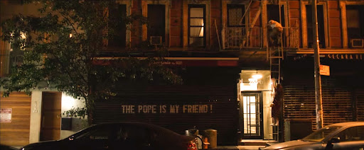 A couple climbs a fire escape to have an informal pizza date in the 2018 film Set It Up.