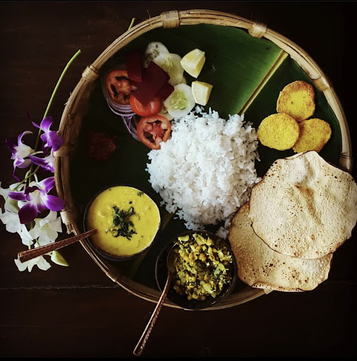 A picture of a Vegetarian Thali (South Indian Origin).