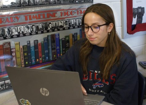 Sarah Portanka, editor-in-chief of the yearbook, works diligently for the benefit of a massive amount of pages and people.