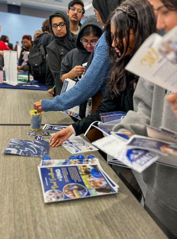 Students at Denmark High grabbing  college pamphlets.