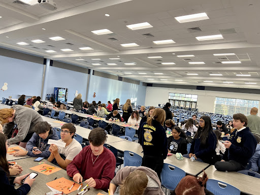 FFA members gather and work with crafts to prepare for what's coming.