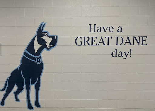 A mural painted within the hallway of Denmark High School. which states a signature quote and our mascot.