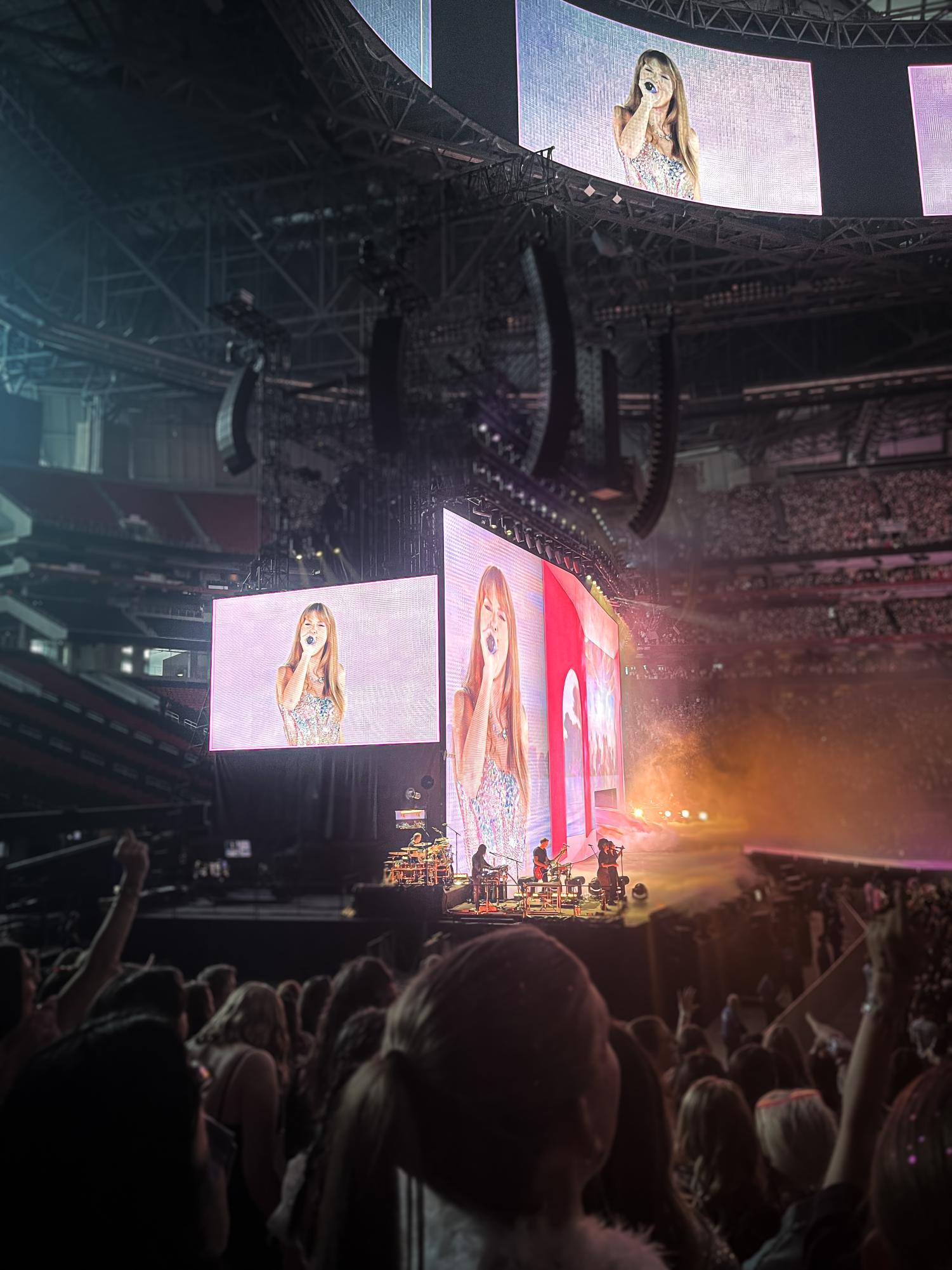 Taylor Swift performing at The Eras Tour at the Mercedes-Benz Stadium.