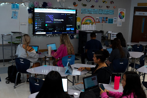 The teacher put on a playlist for her students to listen to as they do their work.
