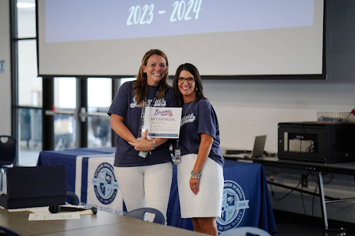 A photo of the teacher of the year, Mrs. Whitlock, with the principle, Ms. Oliver.