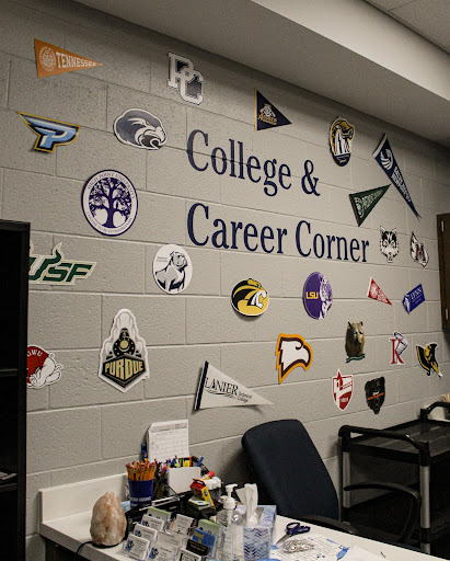 A wall located in the counseling office that shows a variety of colleges to choose from.